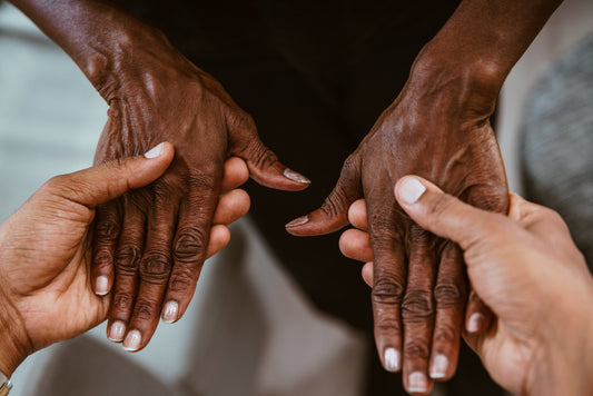 Caregiver holding an older person's hands